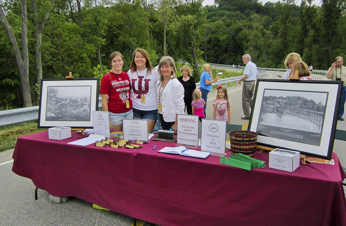 Line tour registration table set up at the foot of Spring Street Hill Road, the location where the long, high trestle connected to the Highland Railway depot platform.  Working the table is Nancy Stein and her two daughter, left, Hanna and Rachel Gish.