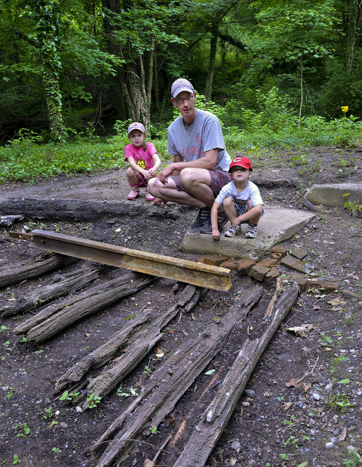 Jason Meyer and his children enjoy viewing the old cross ties, which date back to the 1890’s.
